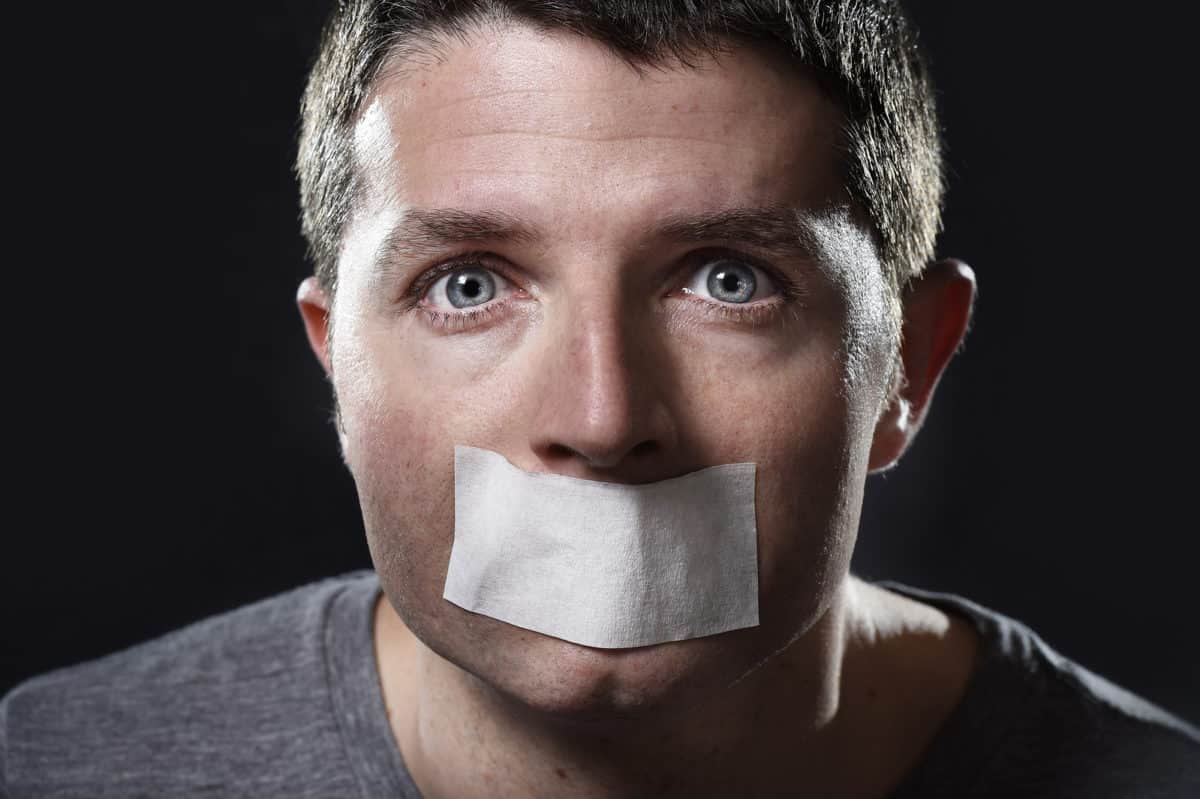Man silenced with tape over his mouth.