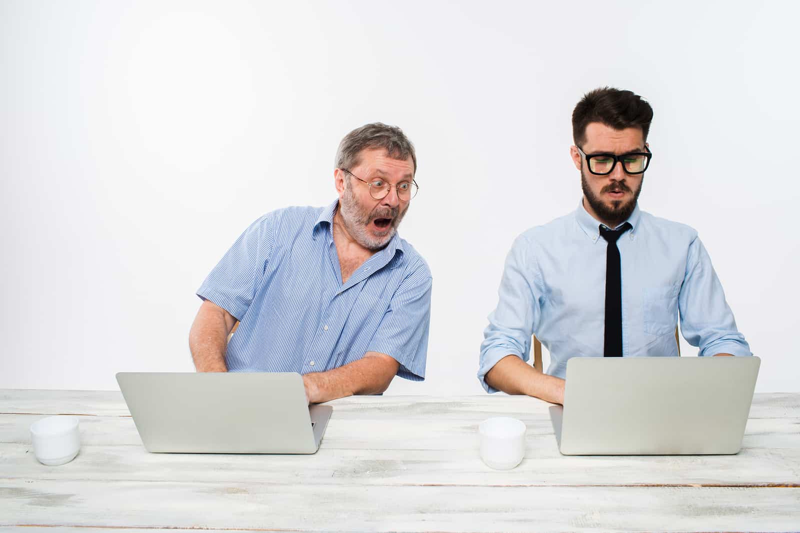 businessmen using laptops